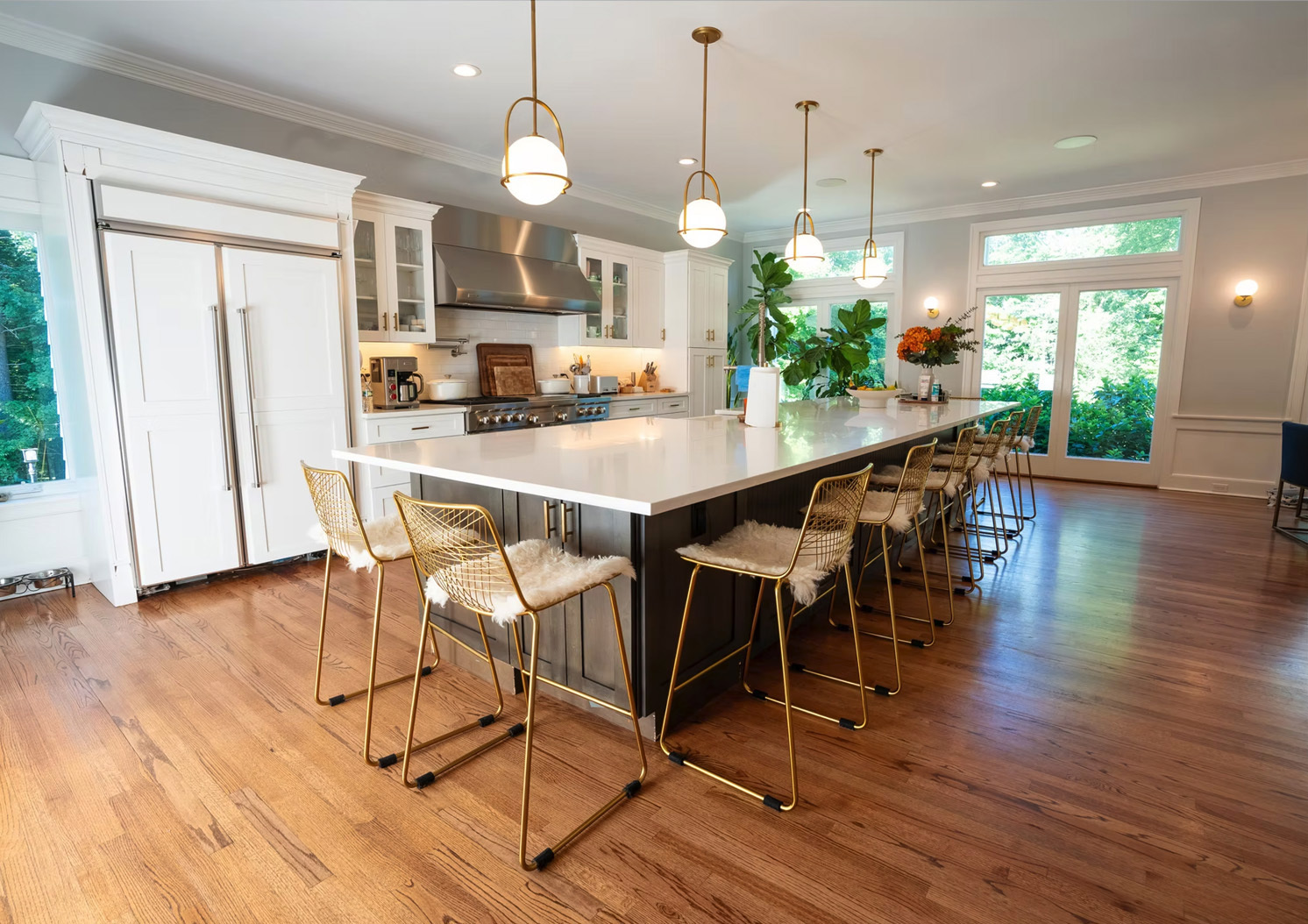 Kitchen with the warm pendant and sconce lights on